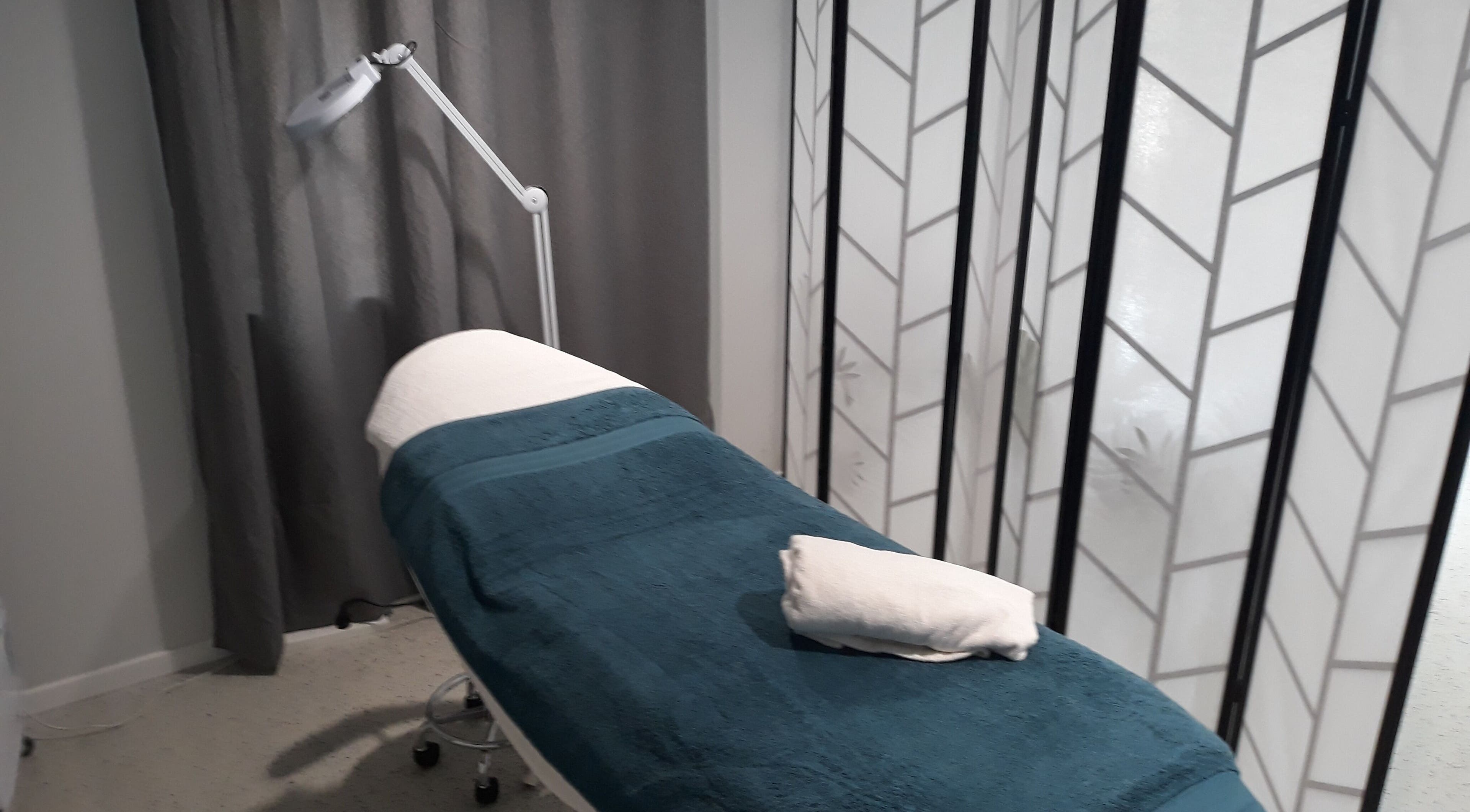 Cozy treatment room at Essential Beauty 2 U in Victory Heights, Queensland, AU with a relaxing treatment bed.