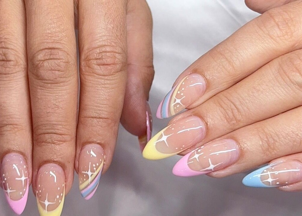 Colorful nail art at Davie Nails, Davie, Florida, US, showcasing vibrant pastel designs on styled nails.