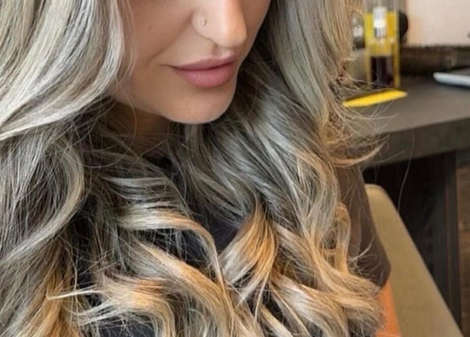 Flowing blonde hair styled in soft waves at KcHair, Borehamwood, England, GB.