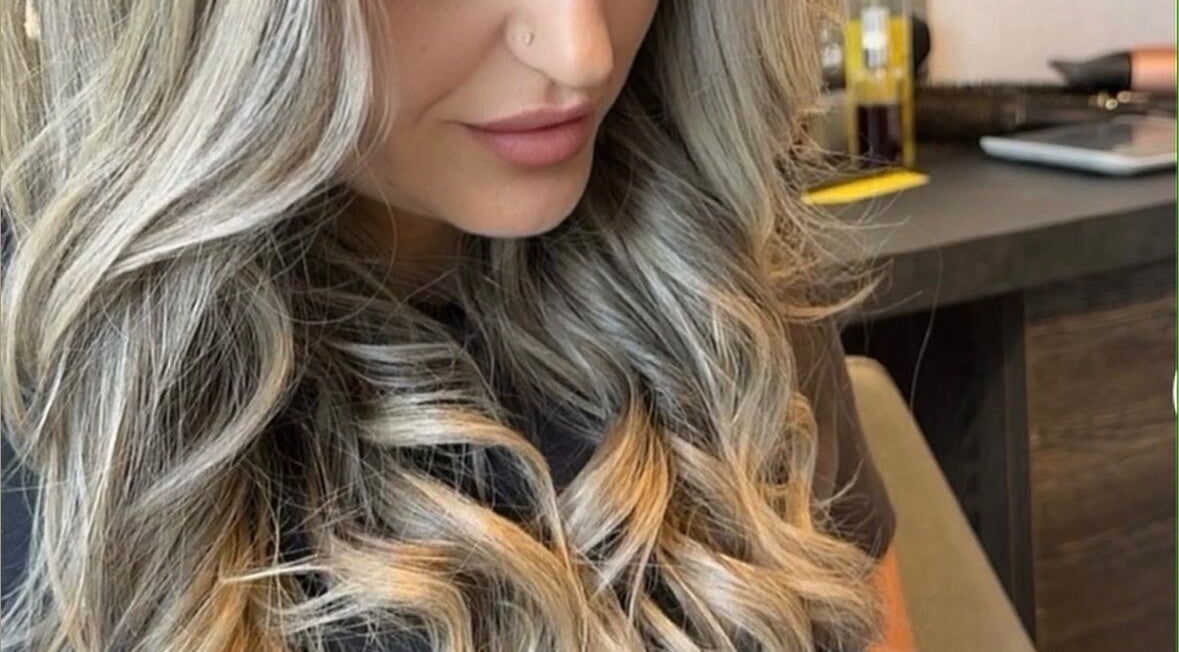 Flowing blonde hair styled in soft waves at KcHair, Borehamwood, England, GB.