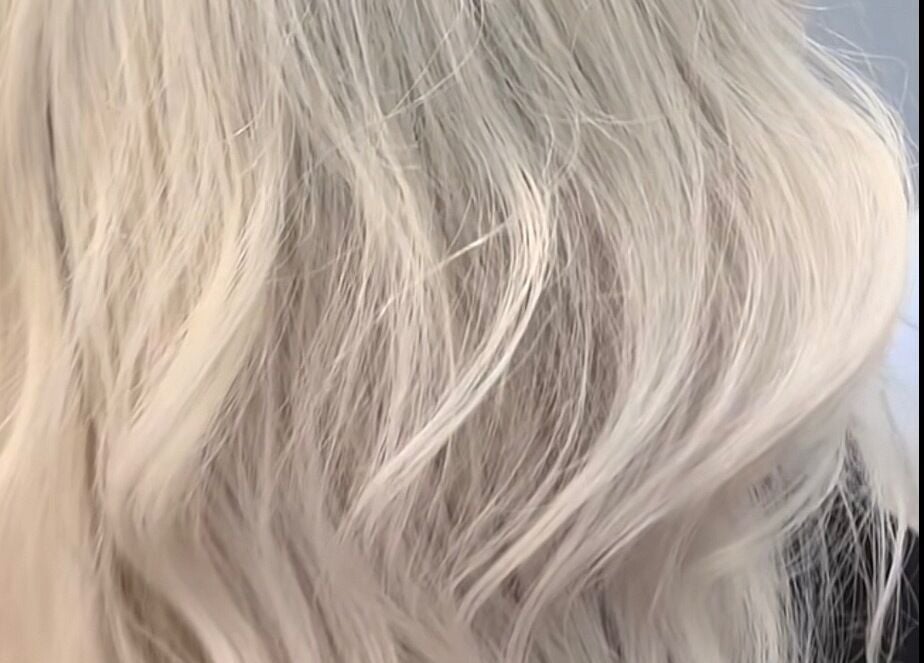 Sleek blonde waves styled at KcHair, Borehamwood, England, GB offering premium hair services.
