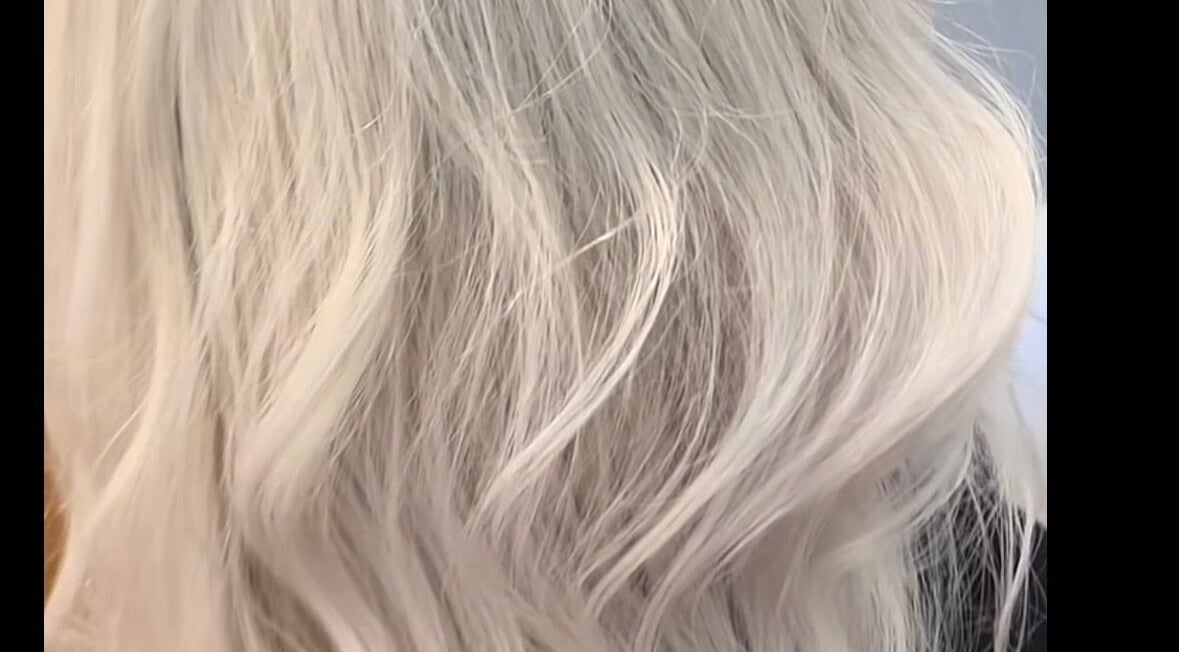 Sleek blonde waves styled at KcHair, Borehamwood, England, GB offering premium hair services.