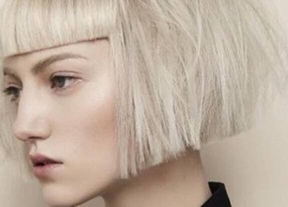 Woman with chic platinum bob hairstyle at Dom Republic in Johannesburg, Gauteng, ZA.