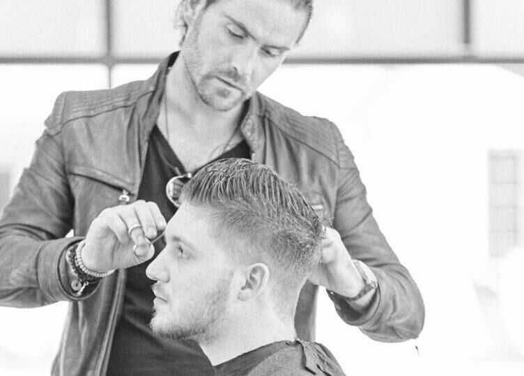 Professional hair stylist working on a haircut at Dom Republic, Johannesburg, Gauteng, ZA.