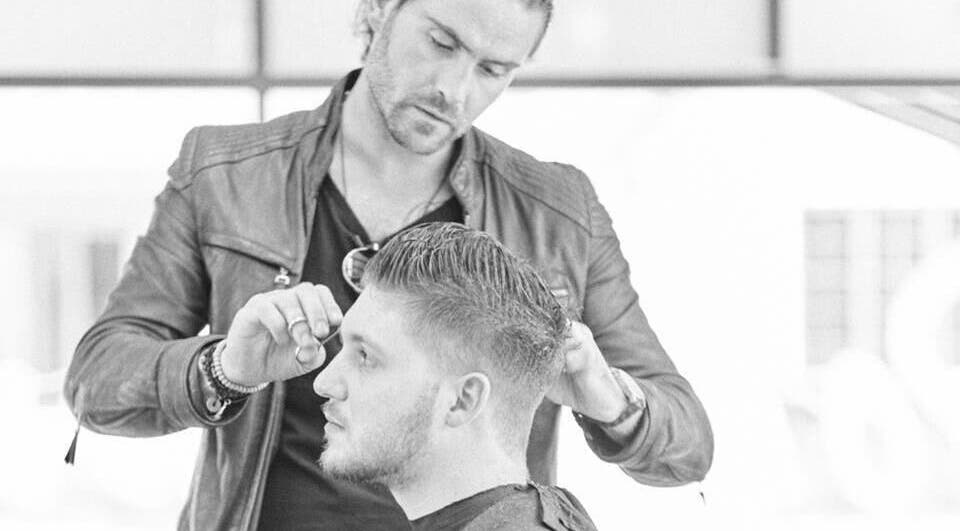 Professional hair stylist working on a haircut at Dom Republic, Johannesburg, Gauteng, ZA.