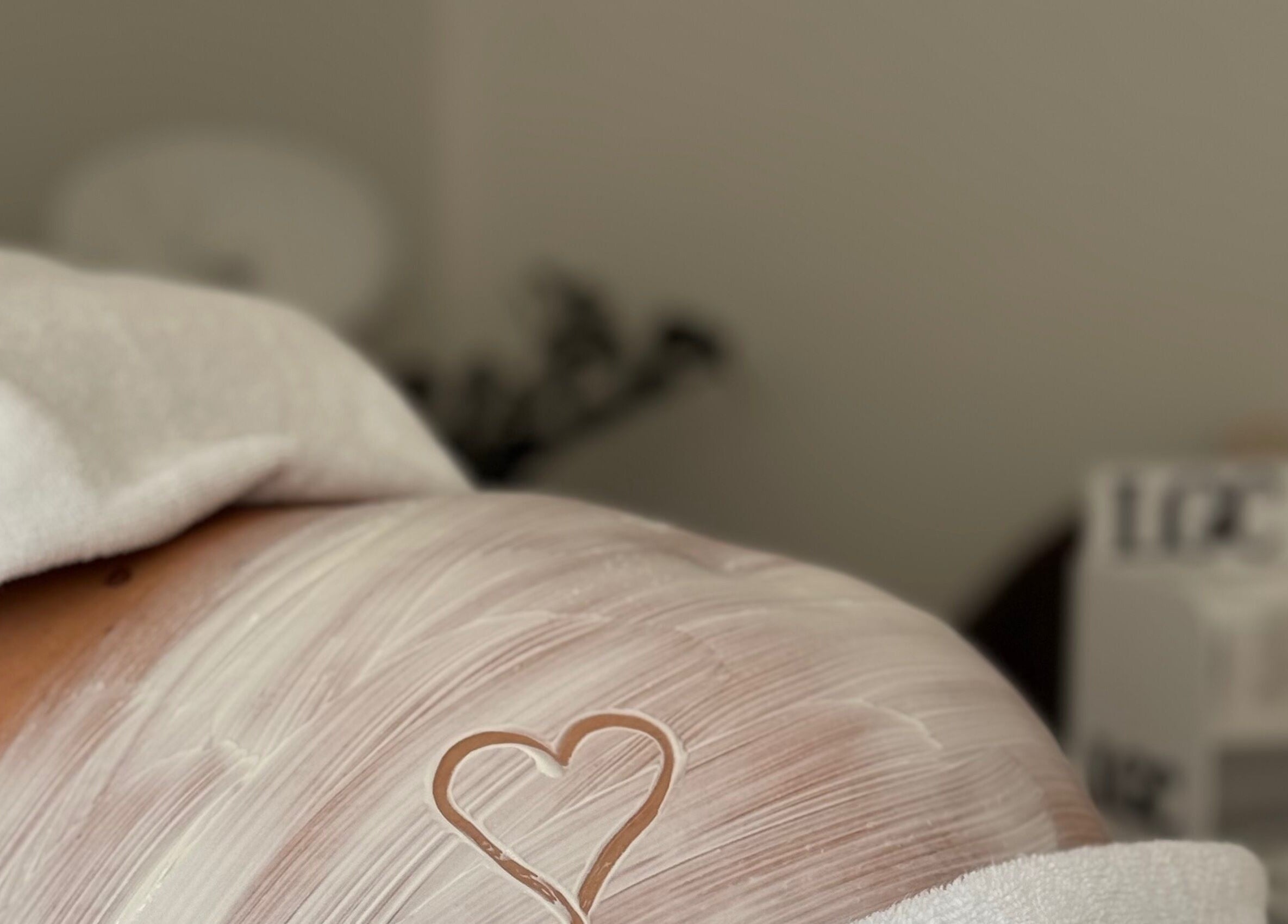 Close-up of a body with a heart shape on cream at Legacy Novi Beograd, Београд, RS.