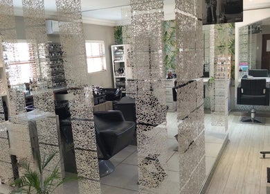 Chic salon interior at Tanak Design / Hair by Nick Ashley in Pretoria, Gauteng, ZA with stylish decor and seating.