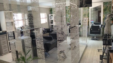 Chic salon interior at Tanak Design / Hair by Nick Ashley in Pretoria, Gauteng, ZA with stylish decor and seating.