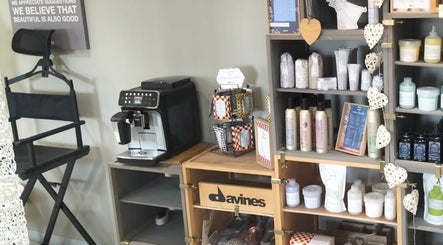 Cozy corner at Tanak Design / Hair by Nick Ashley in Pretoria, Gauteng, ZA, featuring products and a coffee station.