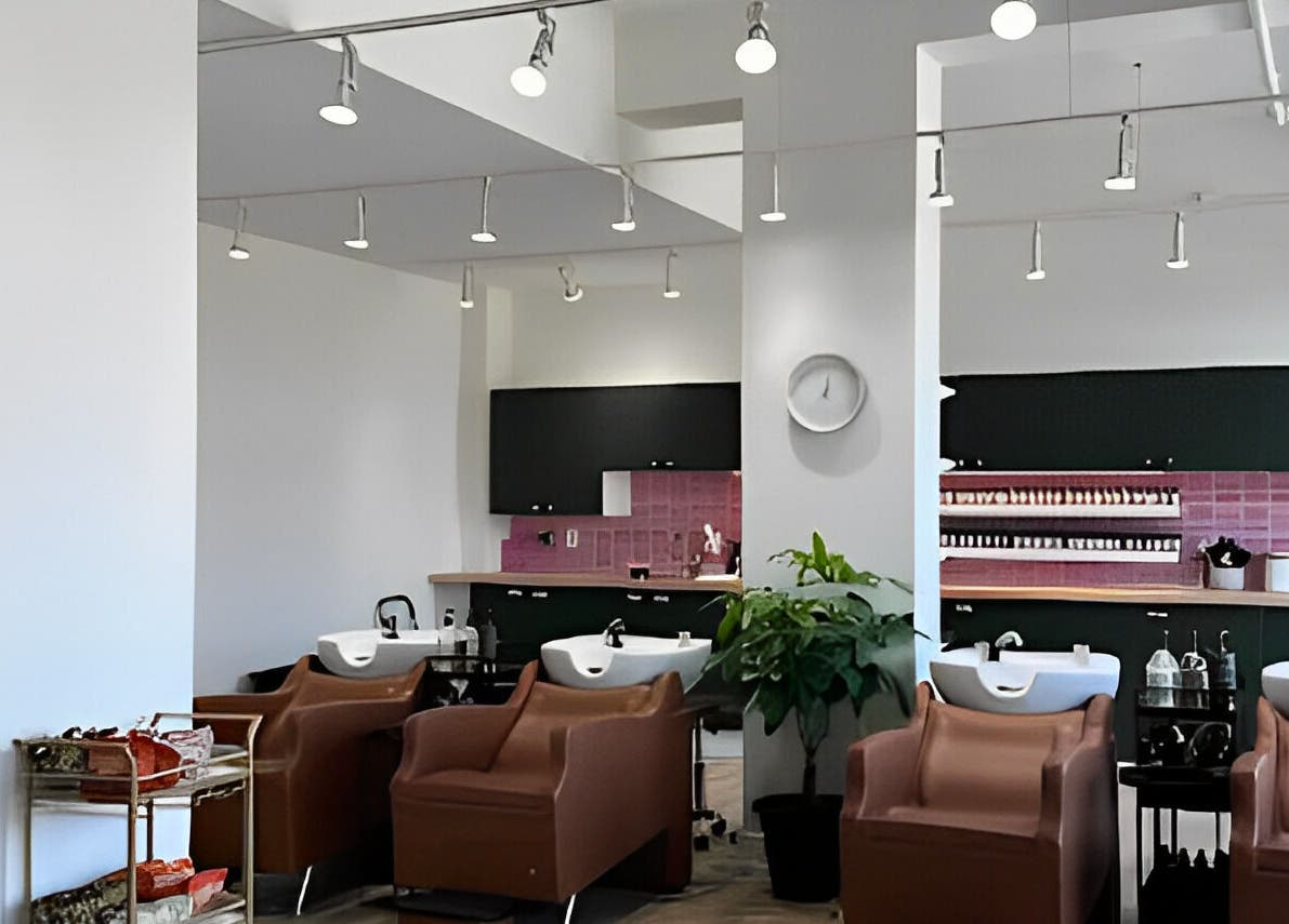 Cozy salon chairs and wash stations at Fika Beauty East, Ottawa, Ontario, CA, offering a serene ambiance.