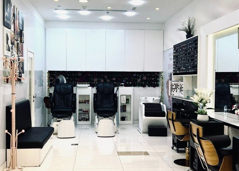 Stylish interior of Companion Beauty Salon Umm Al Quwain Branch, AE showcasing elegant chairs and décor.