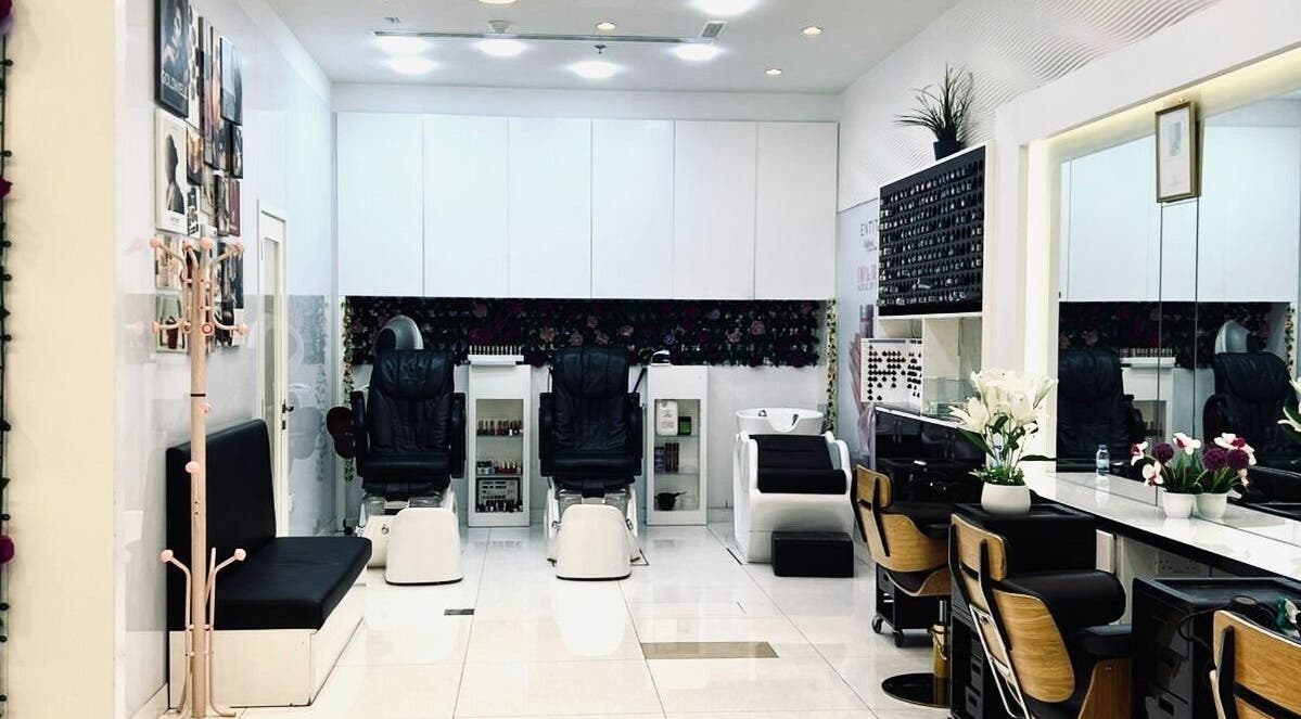 Stylish interior of Companion Beauty Salon Umm Al Quwain Branch, AE showcasing elegant chairs and décor.