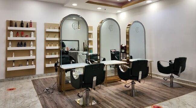 Elegant interior of Companion Beauty Salon Badia Branch in Dubai, AE featuring modern styling chairs and mirrors.
