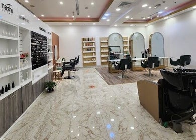 Interior of Companion Beauty Salon Badia Branch, Dubai, AE, showcasing modern styling stations and products.