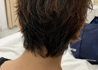 Back view of a chic pixie haircut at Monica Mobil hairdresser, London, GB.
