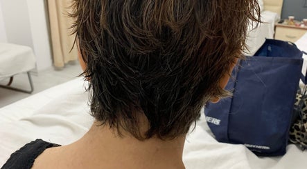 Back view of a chic pixie haircut at Monica Mobil hairdresser, London, GB.