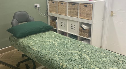 Relaxing therapy room at Balancing Touch Complementary Therapies in Risca, Wales, GB, featuring a massage bed.