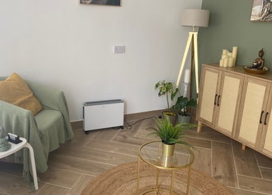 Relaxing corner at Balancing Touch Complementary Therapies, Risca, Wales, GB, with cozy chair and decor.