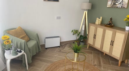 Relaxing corner at Balancing Touch Complementary Therapies, Risca, Wales, GB, with cozy chair and decor.