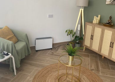 Cozy seating with plants and decor at Balancing Touch Complementary Therapies in Risca, Wales, GB.