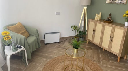 Cozy seating with plants and decor at Balancing Touch Complementary Therapies in Risca, Wales, GB.