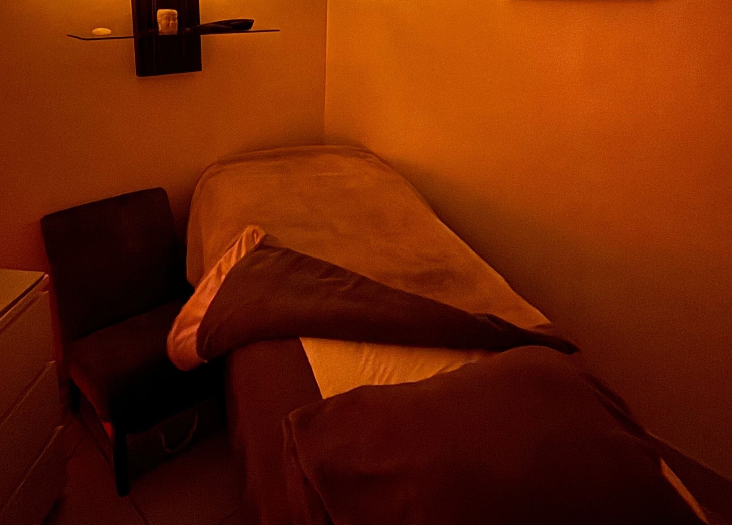 Relaxing massage room at Hester Mind, Body and Soul in Weston-super-mare, England, GB with warm lighting.