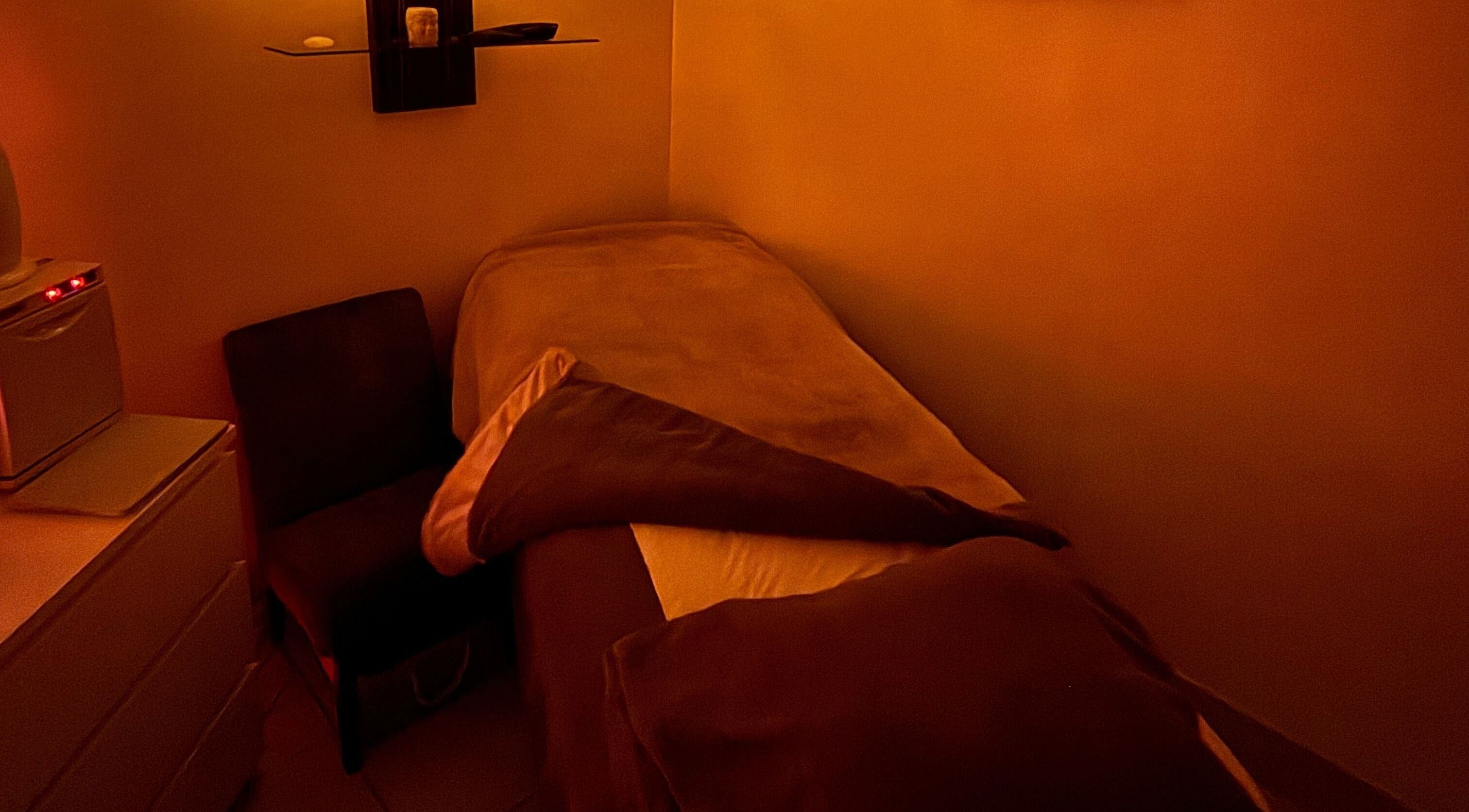 Relaxing massage room at Hester Mind, Body and Soul in Weston-super-mare, England, GB with warm lighting.