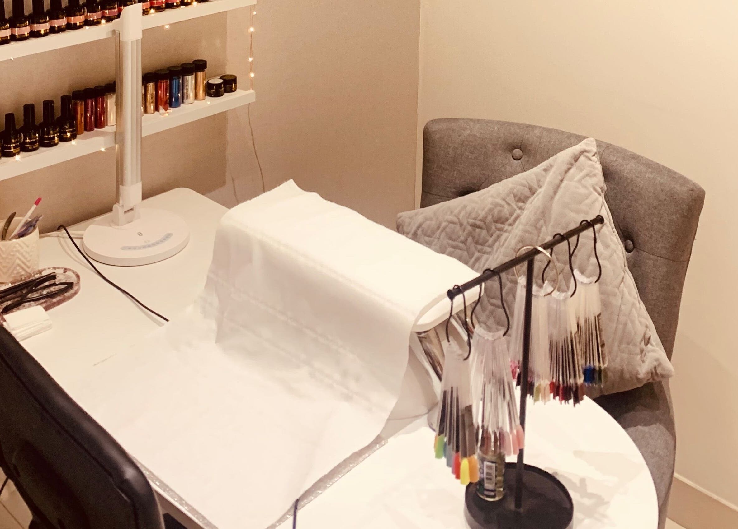 Nail art station at Hester Mind, Body and Soul, Weston-super-mare, England, GB with polish display.