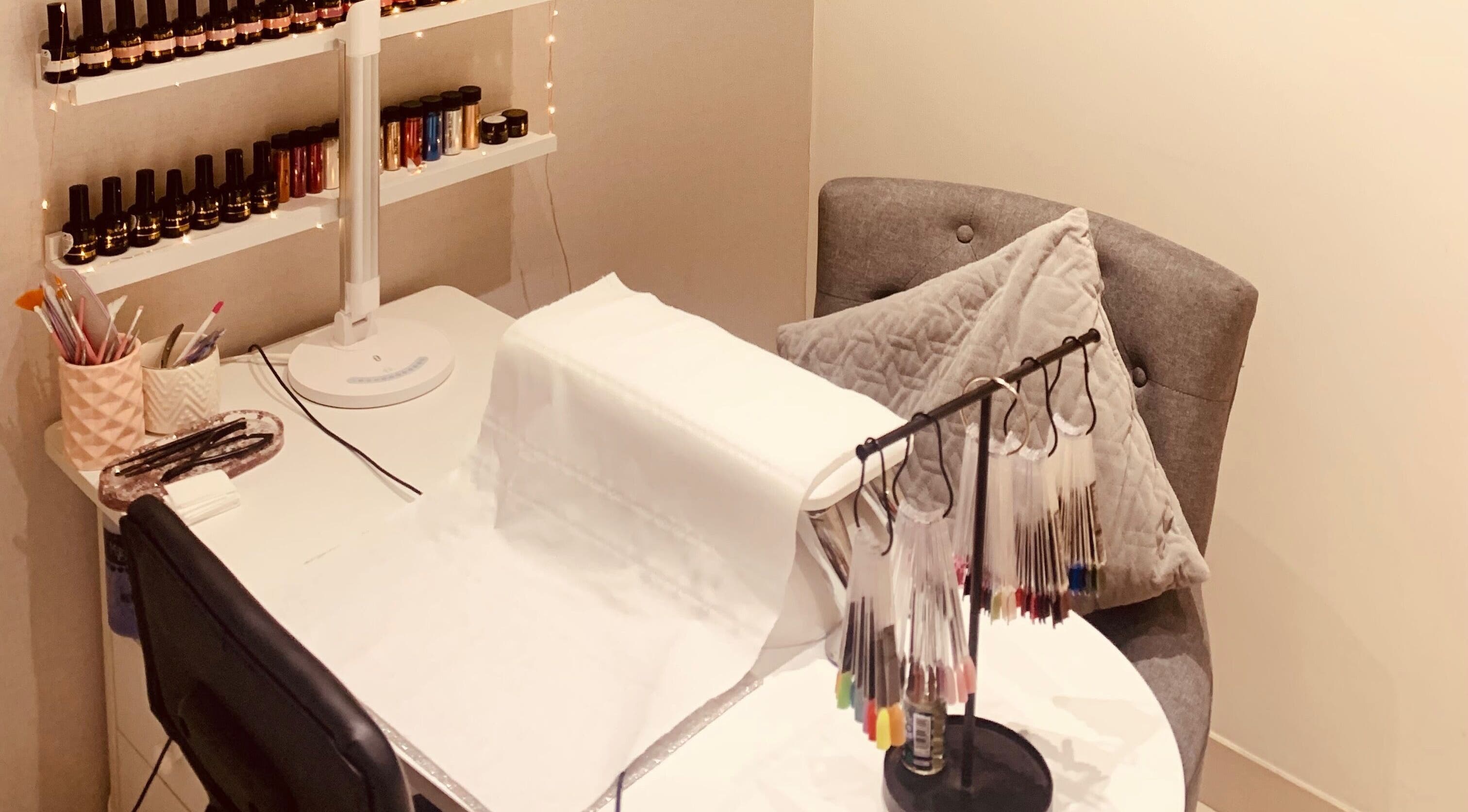 Nail art station at Hester Mind, Body and Soul, Weston-super-mare, England, GB with polish display.