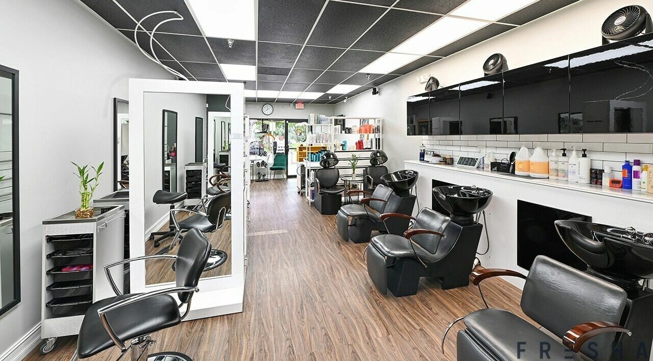 Modern salon chairs and mirrors at Hanna Jade Beauty Bar, Miami Lakes, Florida, US.