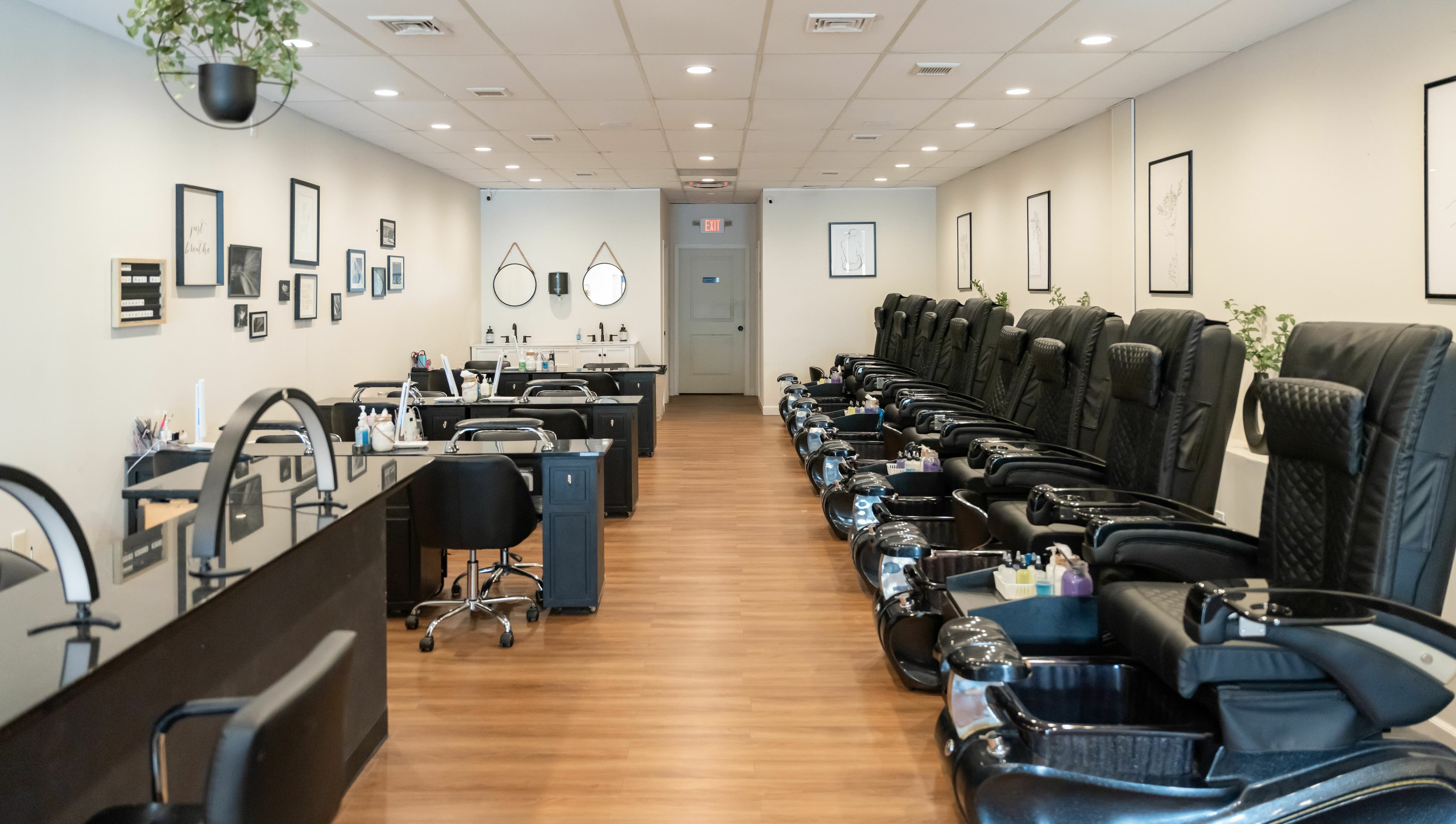 Luxury interior of Onyx Nail Bar in Voorhees Township, New Jersey, US featuring plush black pedicure chairs.