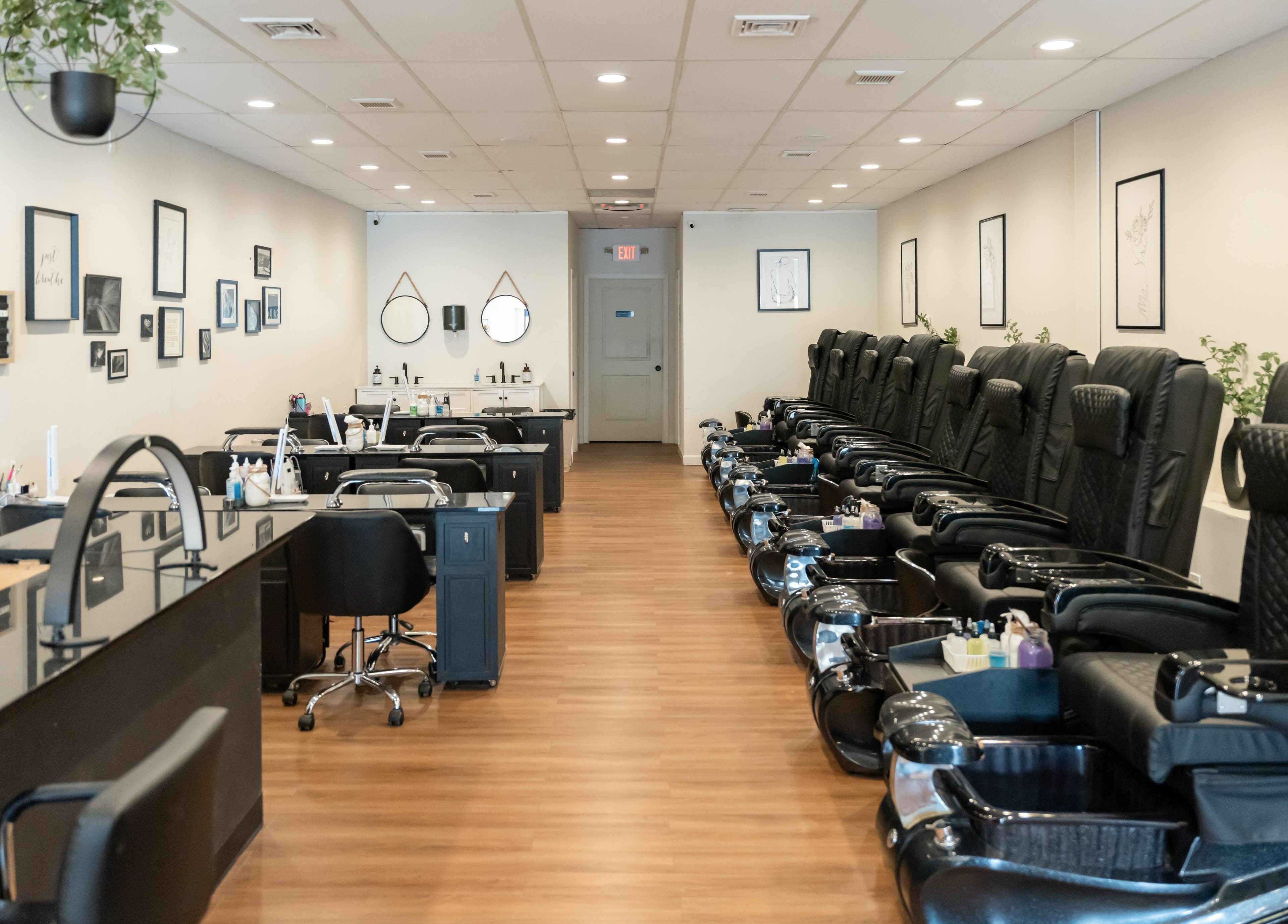 Luxury interior of Onyx Nail Bar in Voorhees Township, New Jersey, US featuring plush black pedicure chairs.