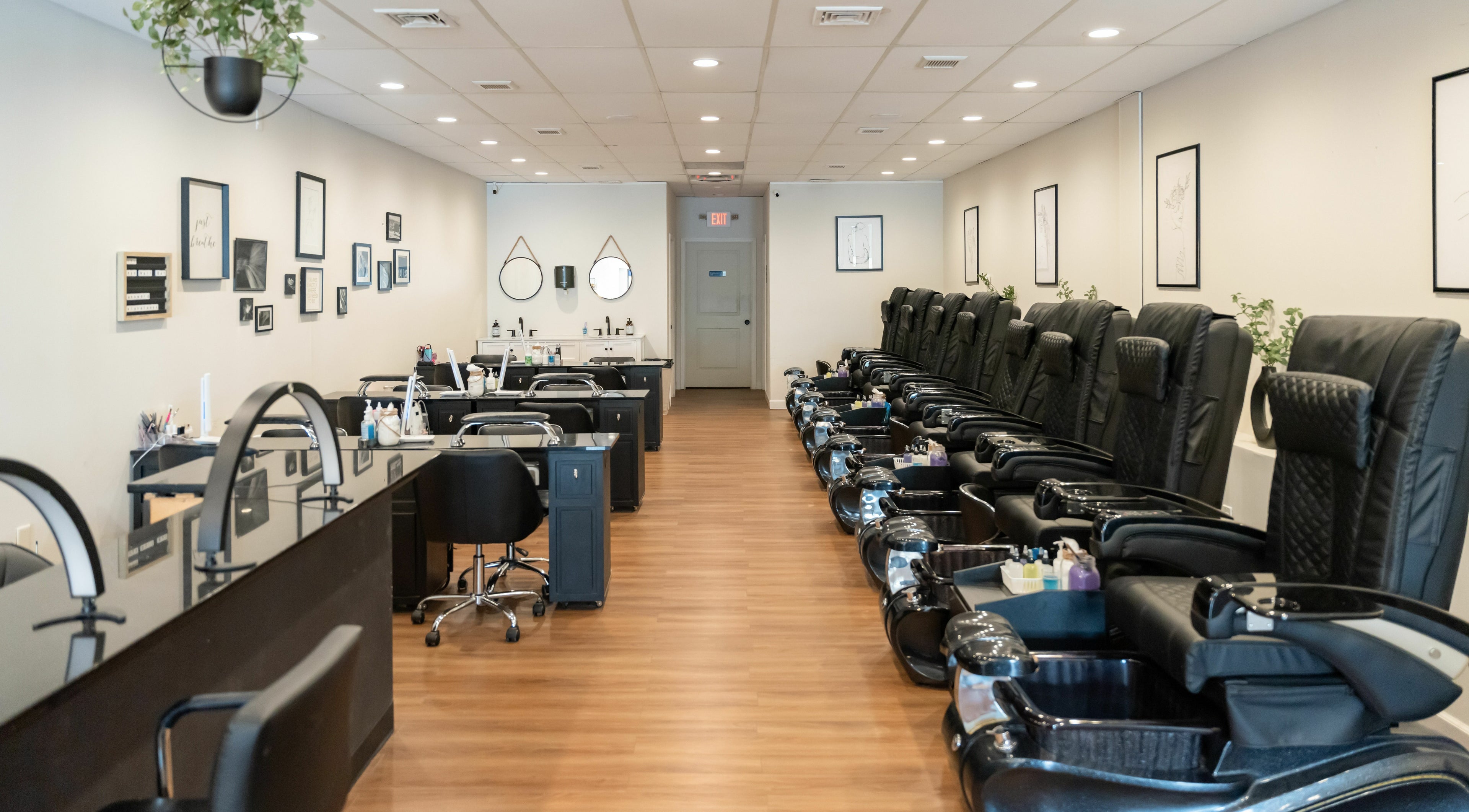 Luxury interior of Onyx Nail Bar in Voorhees Township, New Jersey, US featuring plush black pedicure chairs.