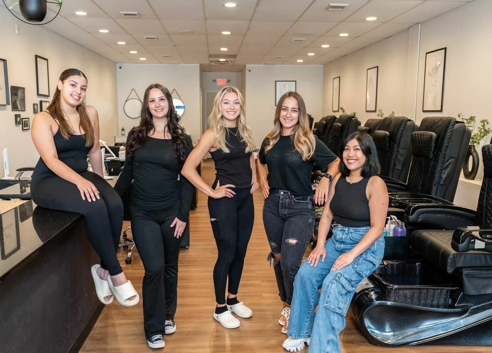 Team at Onyx Nail Bar in Voorhees Township, New Jersey, US, smiling and ready to greet customers.