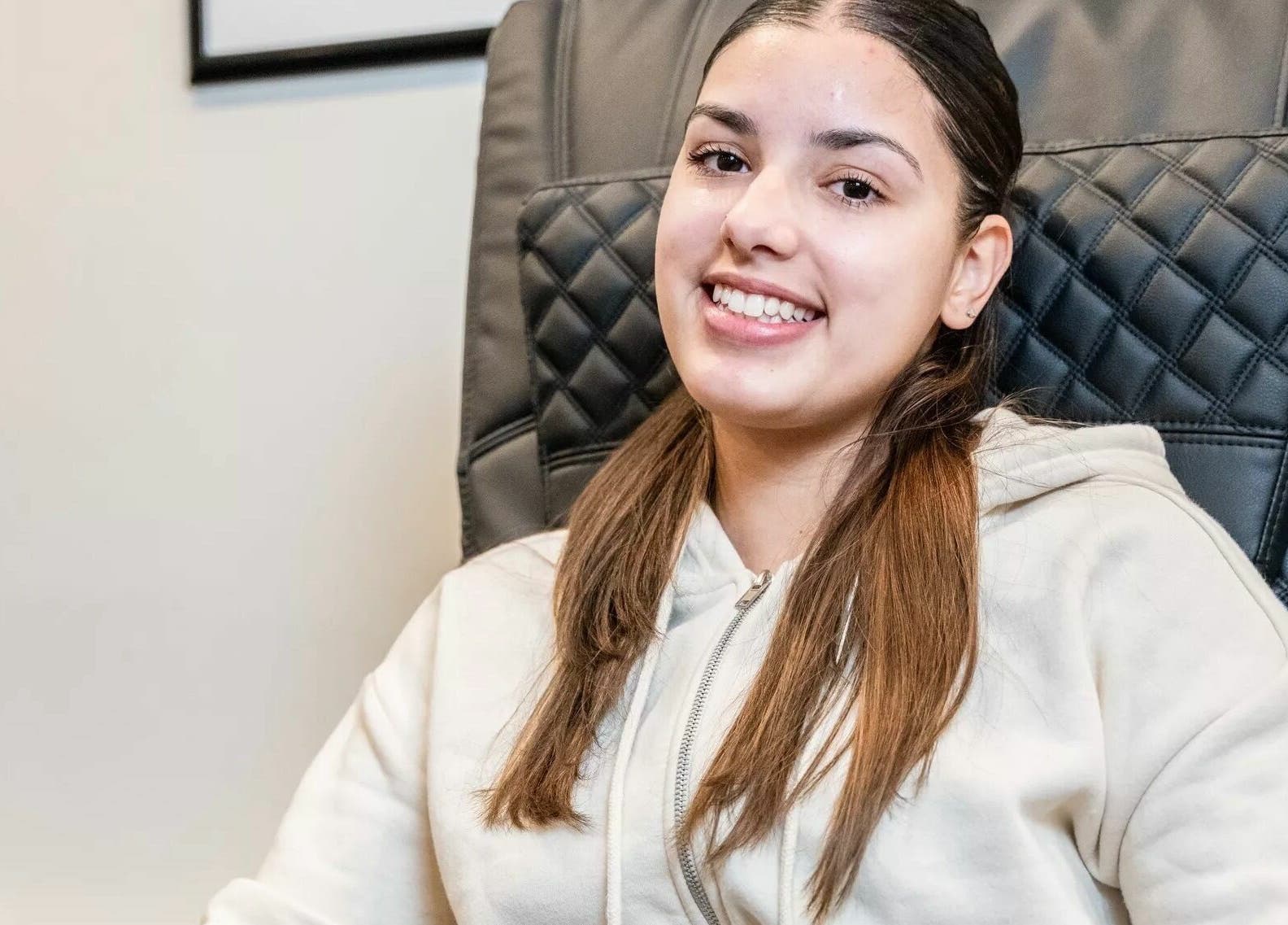 Smiling client enjoying a relaxing moment at Onyx Nail Bar in Voorhees Township, New Jersey, US.