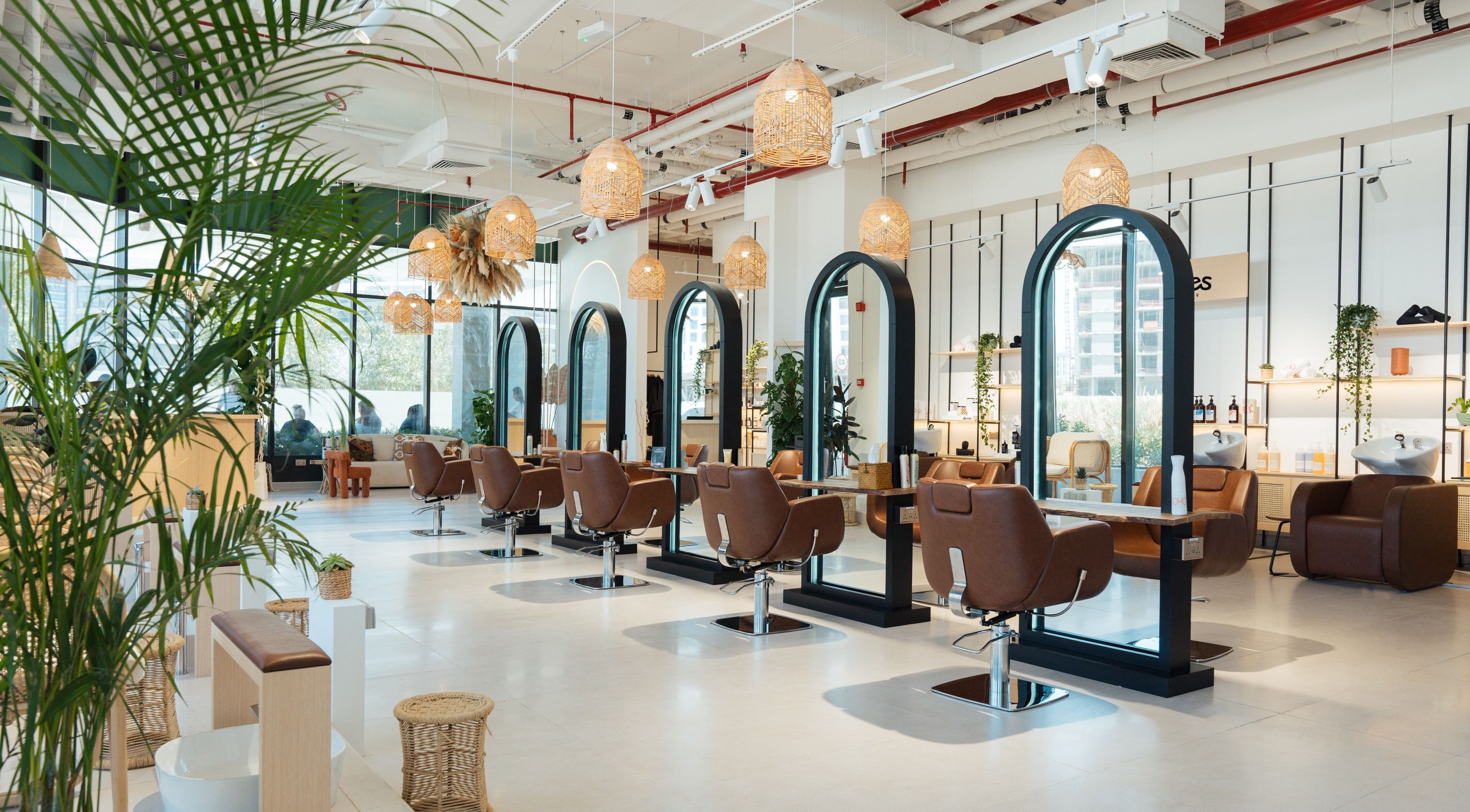 Chic and modern interior of Boho Salon DXB, Dubai, Dubai, AE, showcasing elegant styling stations.