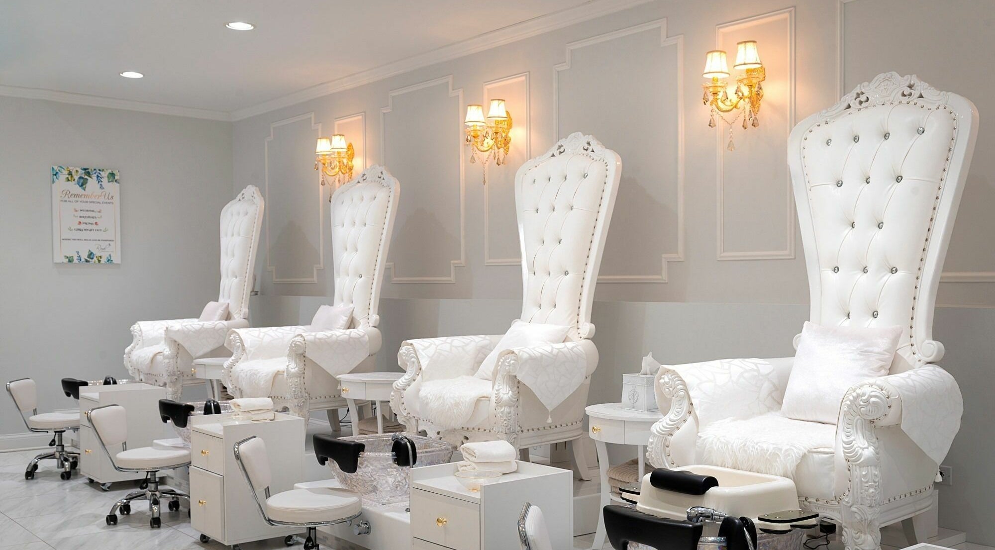 Luxurious white throne chairs at Royal Boutique Nails, Long Grove, Illinois, US, offering a royal nail experience.