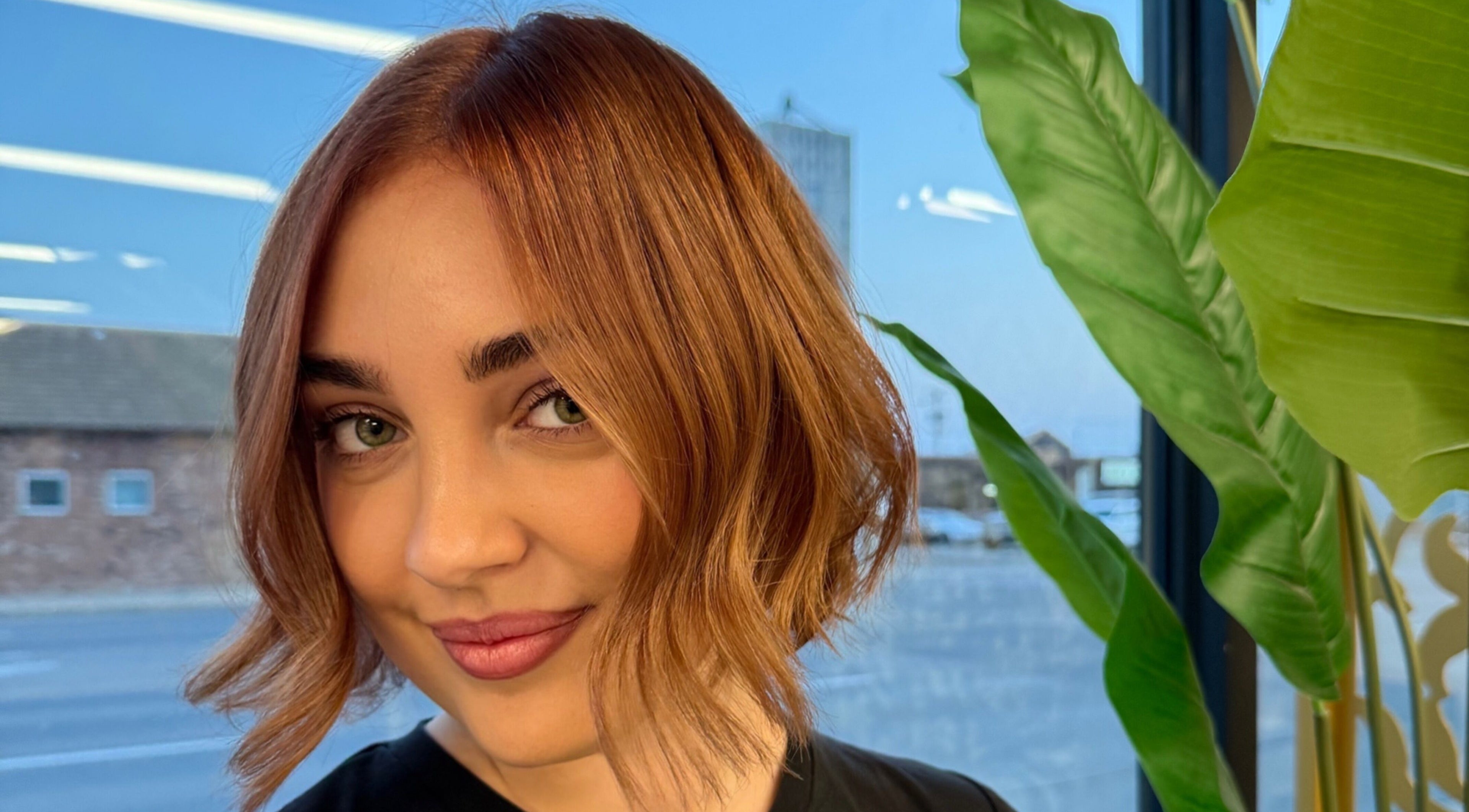 Woman with stylish haircut at Paige at Chic, Moose Jaw, Saskatchewan, CA, showcasing modern salon aesthetics.