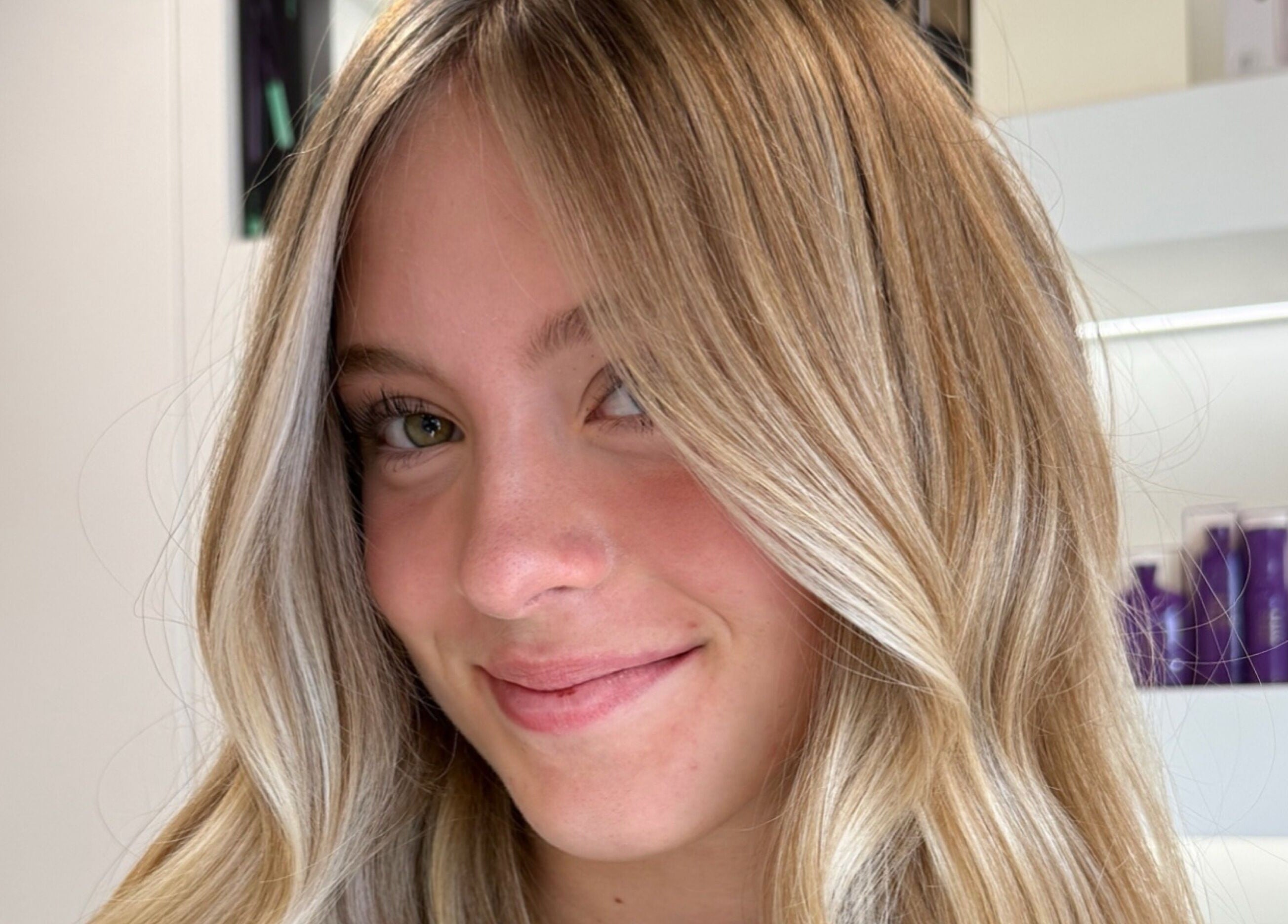 Smiling woman with blonde hair at Paige at Chic, Moose Jaw, Saskatchewan, CA.