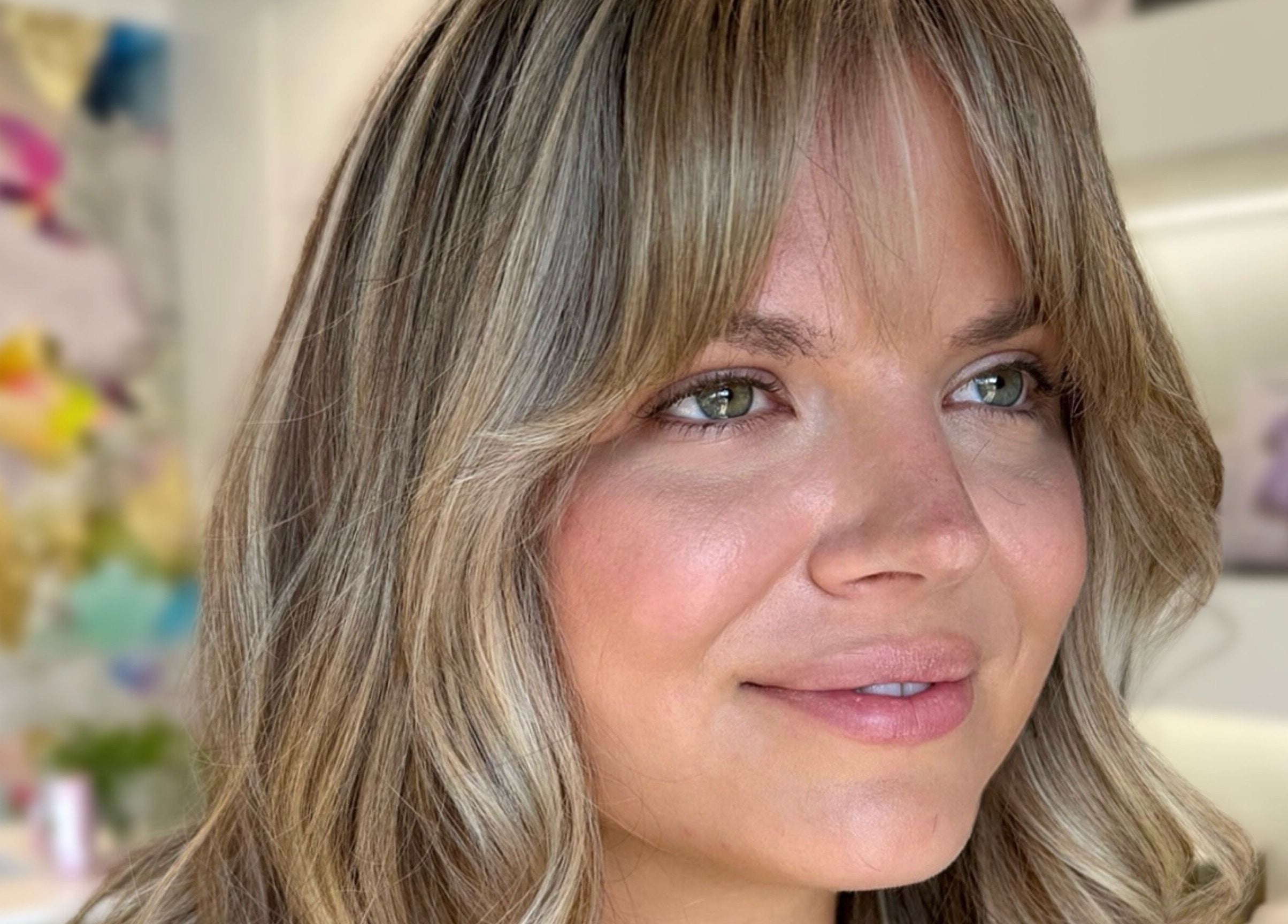 Portrait of a woman with styled hair at Paige at Chic in Moose Jaw, Saskatchewan, CA.