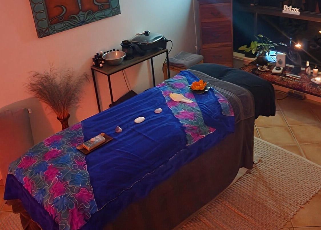 Relaxing massage room at Earth Magic with Suzie Maxwell in Currumbin Waters, Queensland, AU with soothing decor.