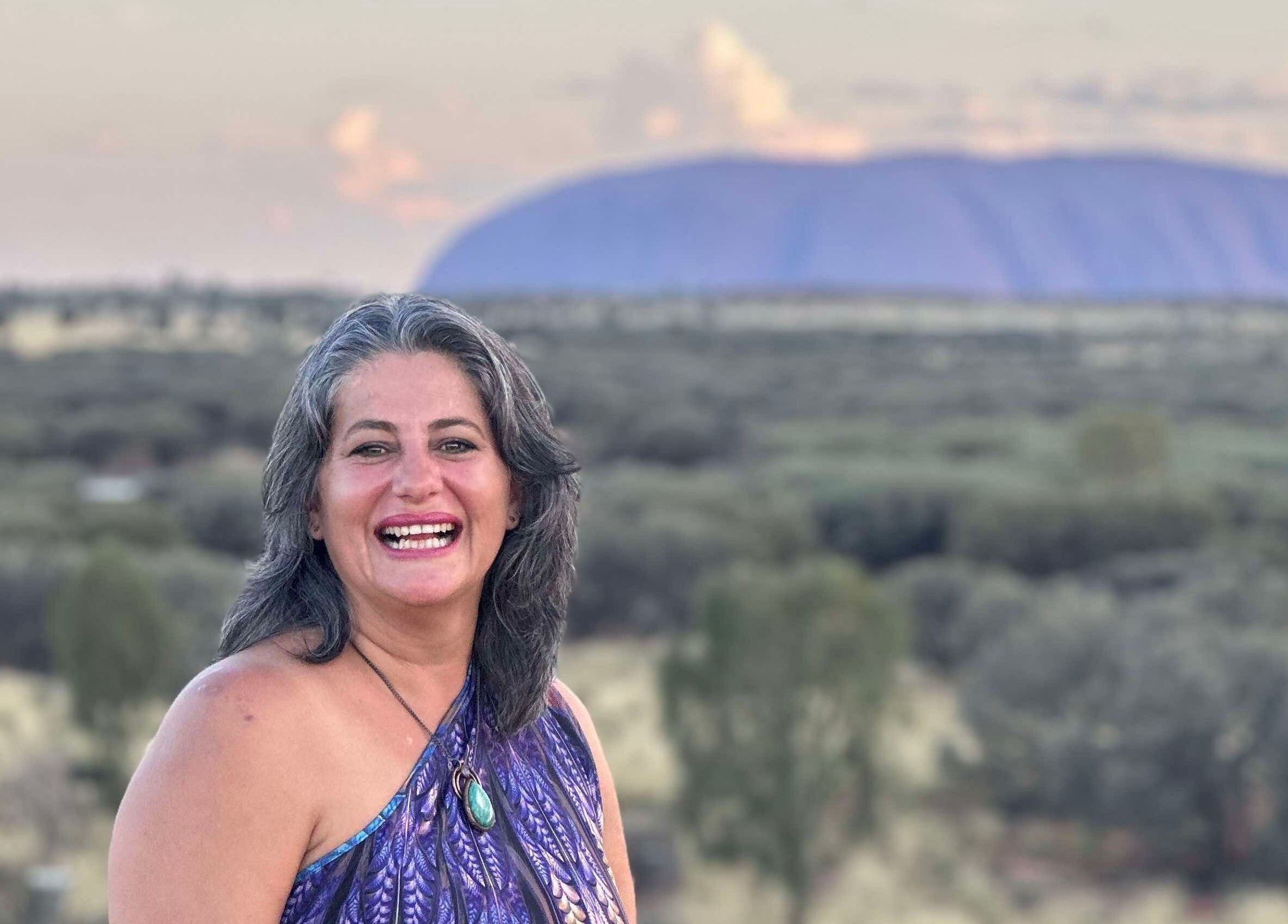 Smiling woman enjoying nature at Earth Magic with Suzie Maxwell, Currumbin Waters, Queensland, AU.