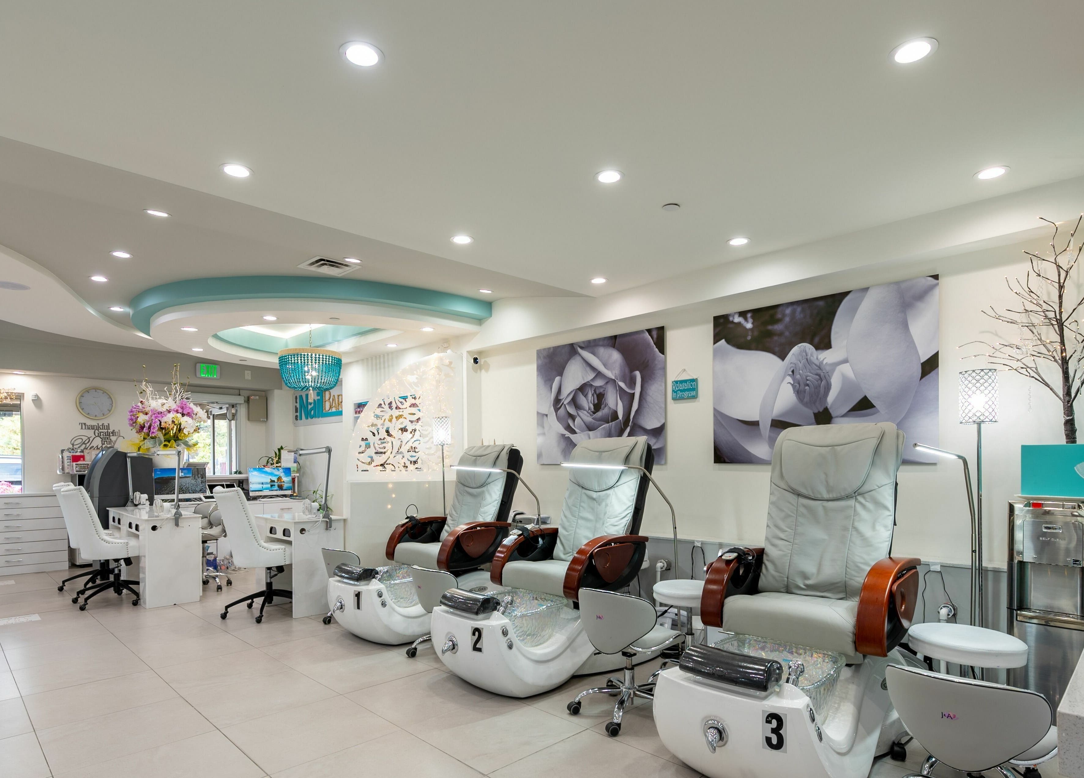 Luxurious interior of The Nail Bar Los Altos, California, US, featuring modern pedicure chairs.