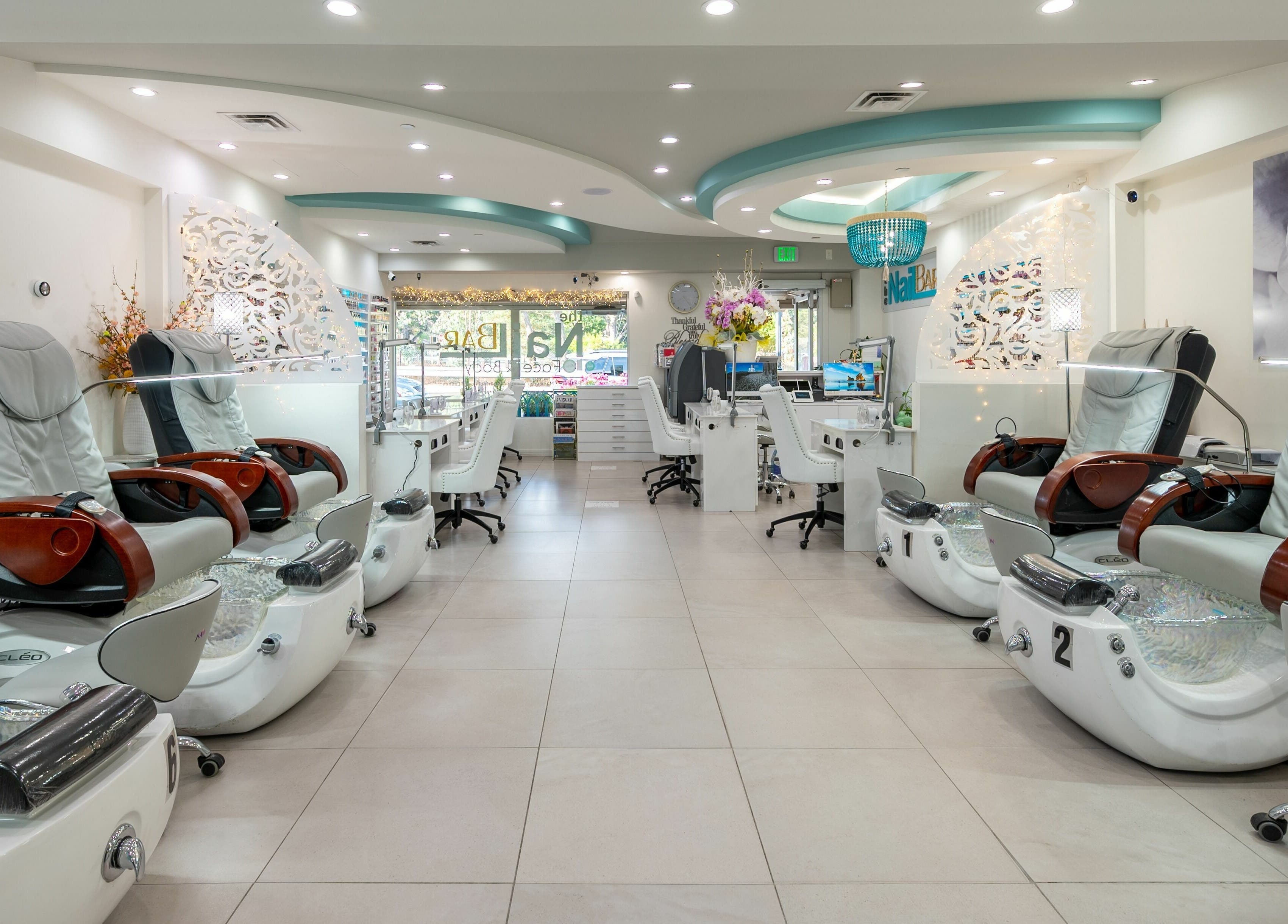 Modern pedicure chairs and stylish decor at The Nail Bar Los Altos, Los Altos, California, US.