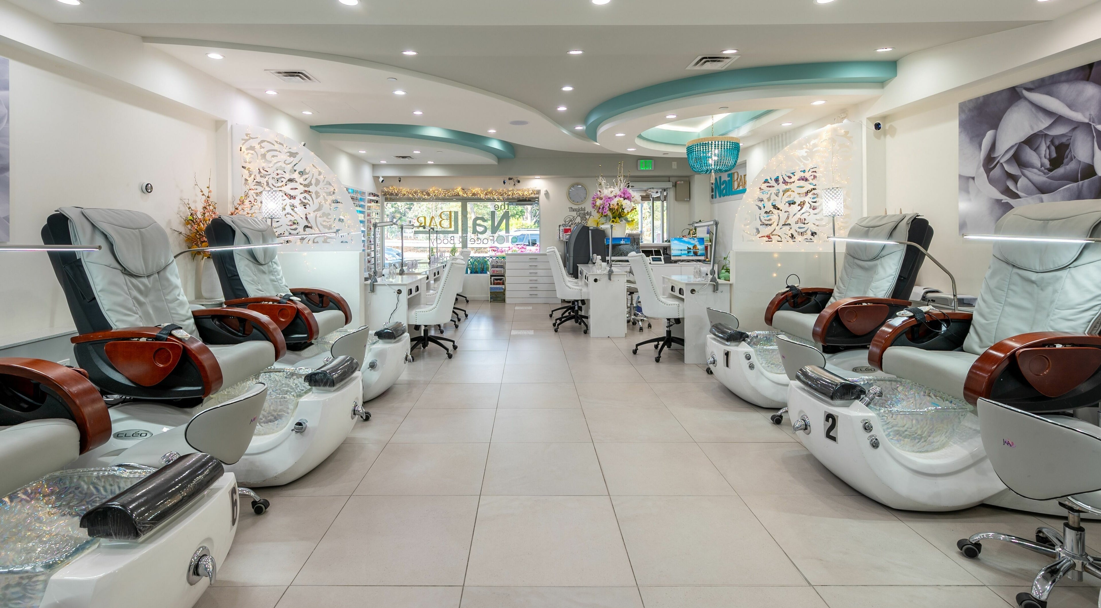 Modern pedicure chairs and stylish decor at The Nail Bar Los Altos, Los Altos, California, US.