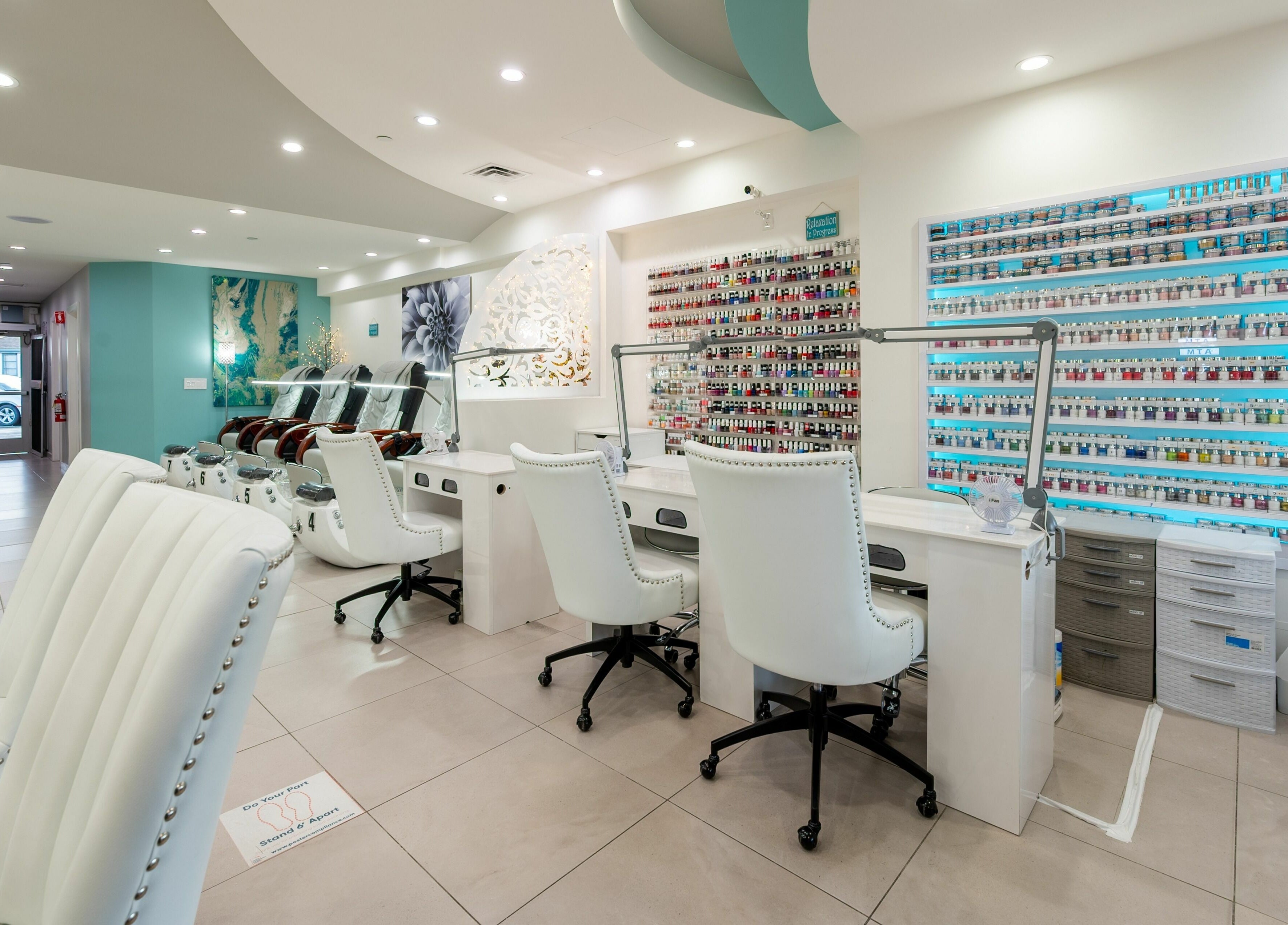 Modern interior of The Nail Bar Los Altos, featuring nail polish displays and seating in Los Altos, California, US.