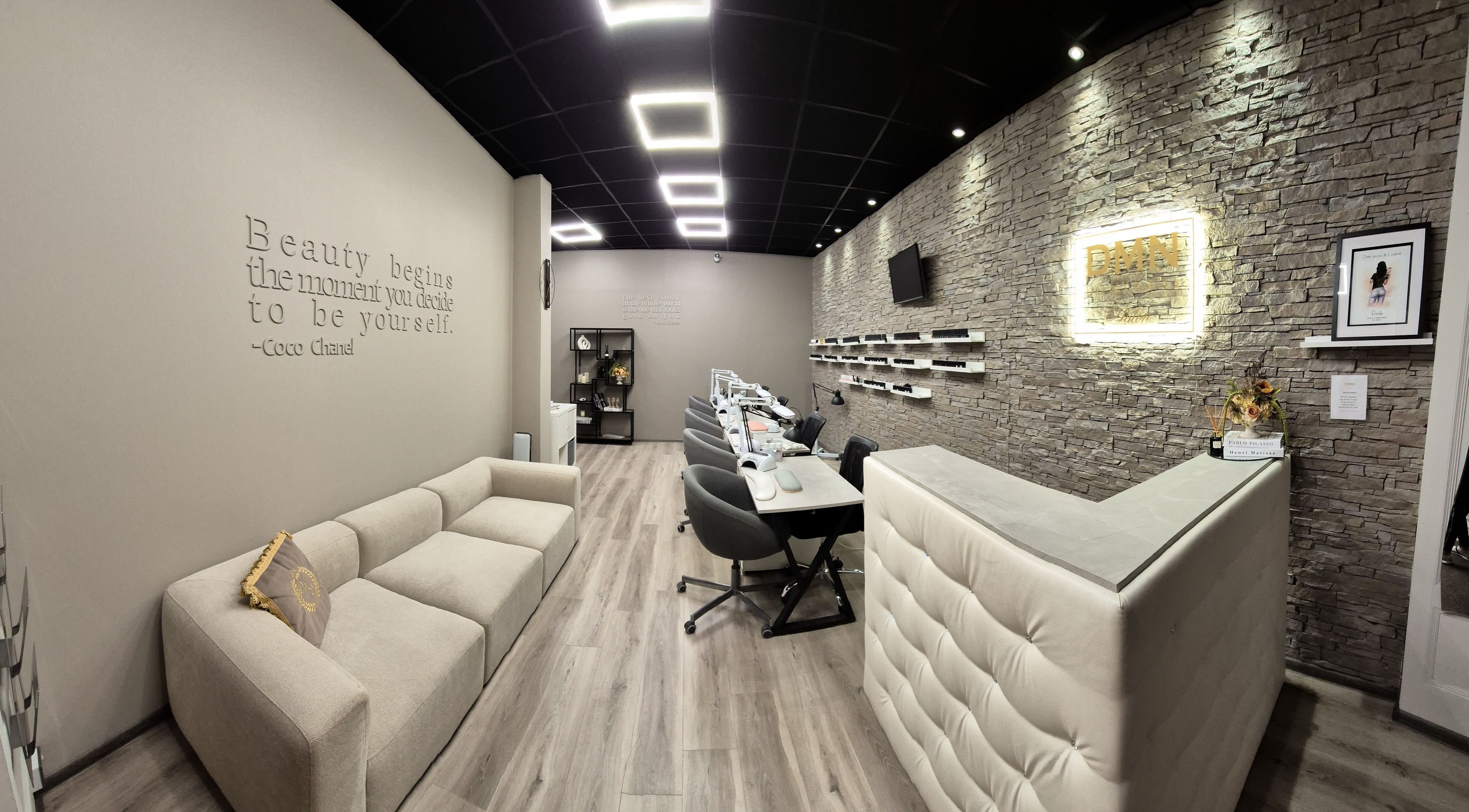 Modern interior of DMN Salon in Tralee, County Kerry, IE, featuring stylish seating and a welcoming reception area.