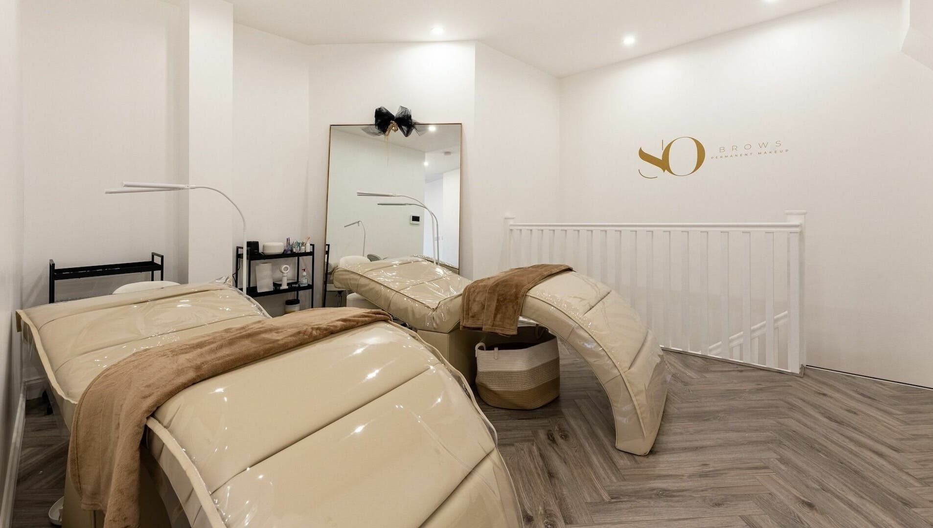 SO Brows beauty room with plush beds and modern decor, London, England, GB.