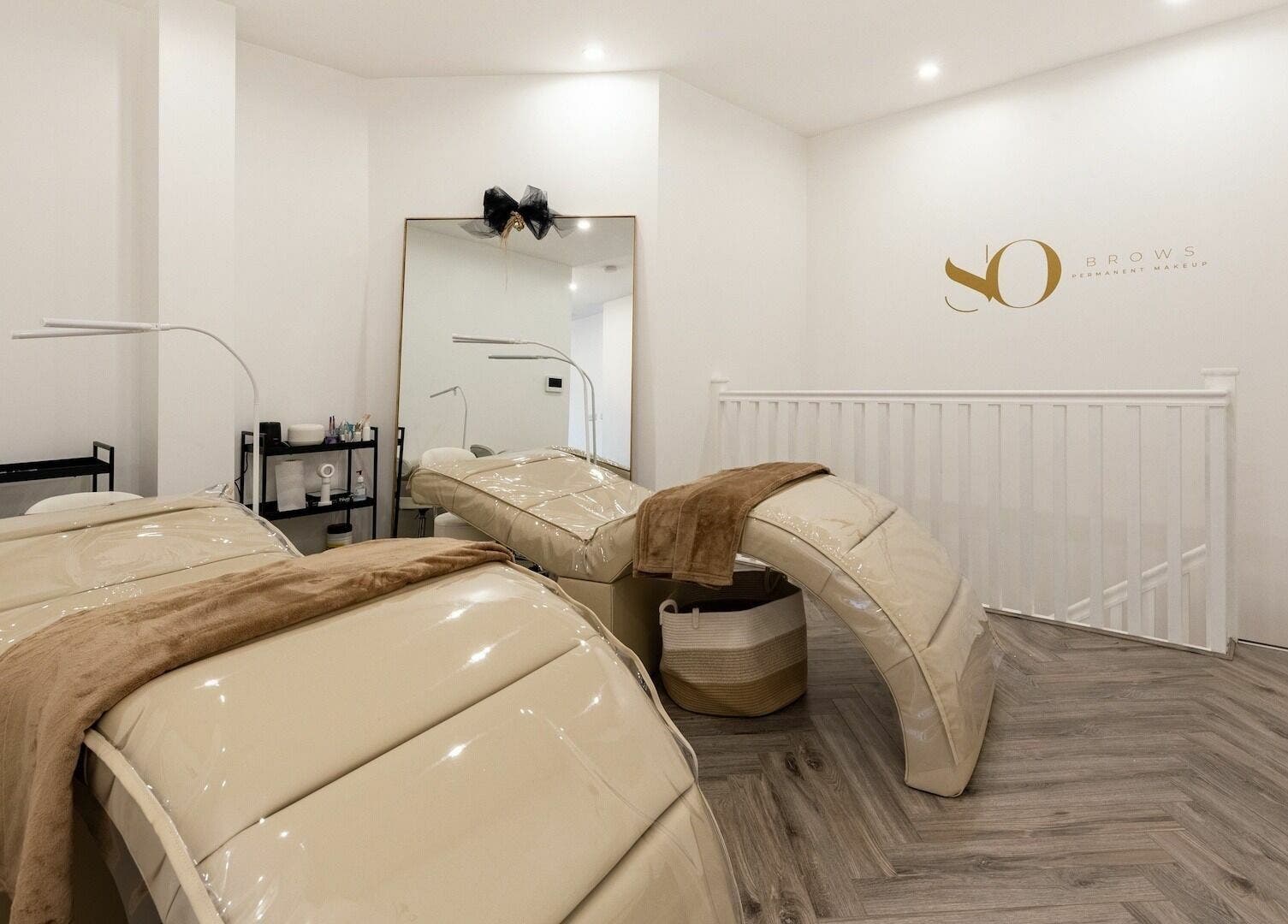 SO Brows beauty room with plush beds and modern decor, London, England, GB.