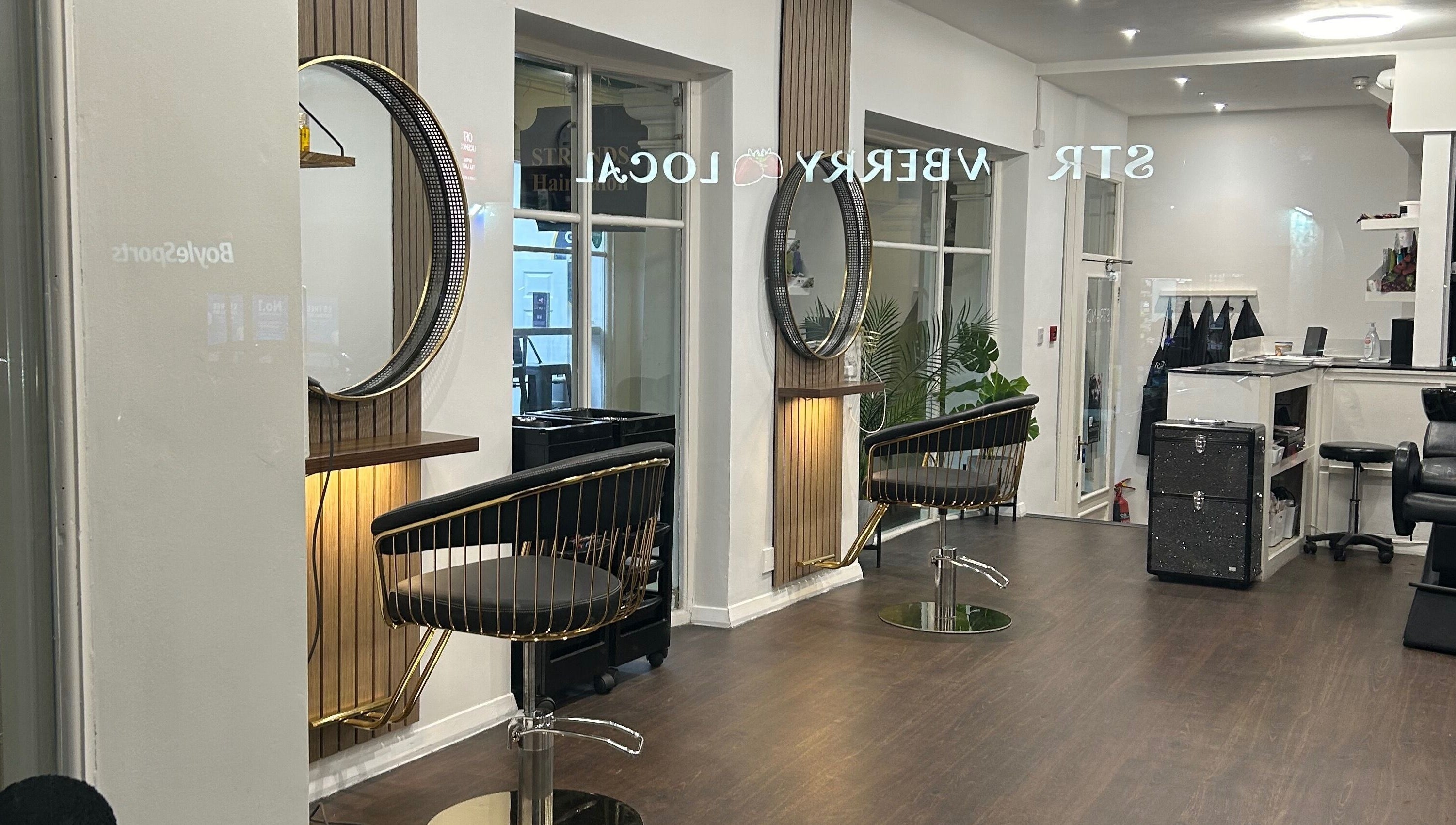 Strands salon Newport Pagnell -Jen interior featuring stylish chairs and mirrors in Newport Pagnell, England, GB.